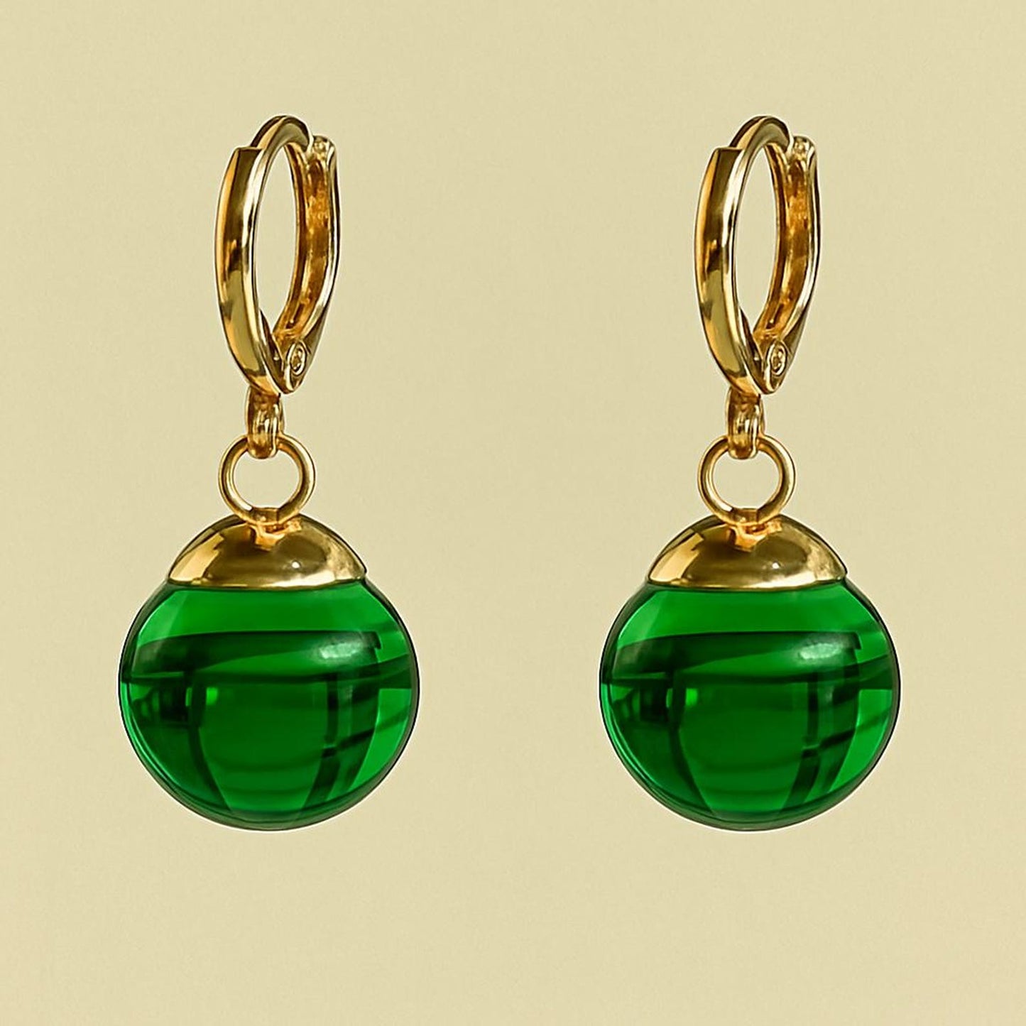 Green Potara fusion earrings with gold accents for anime fans