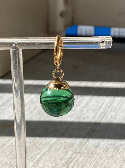 Green Potara fusion earrings with gold accents for anime fans