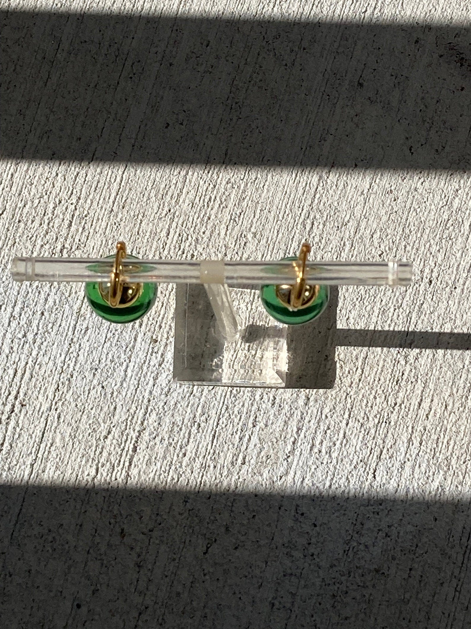 Green Potara fusion earrings with gold accents for anime fans